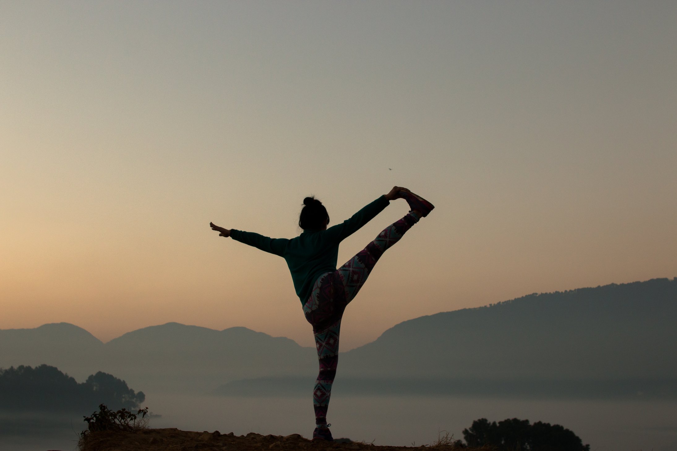 premium wealth solutions person doing yoga