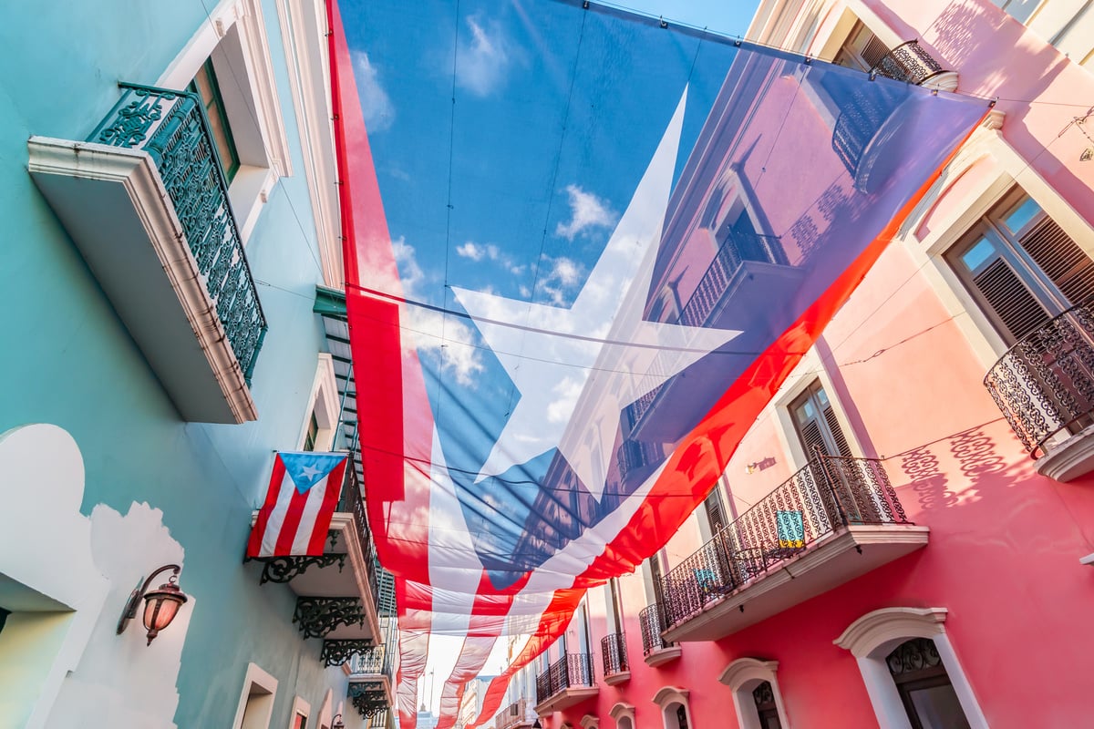 Large flag of Puerto Rico above the street in the city center of San Juan.